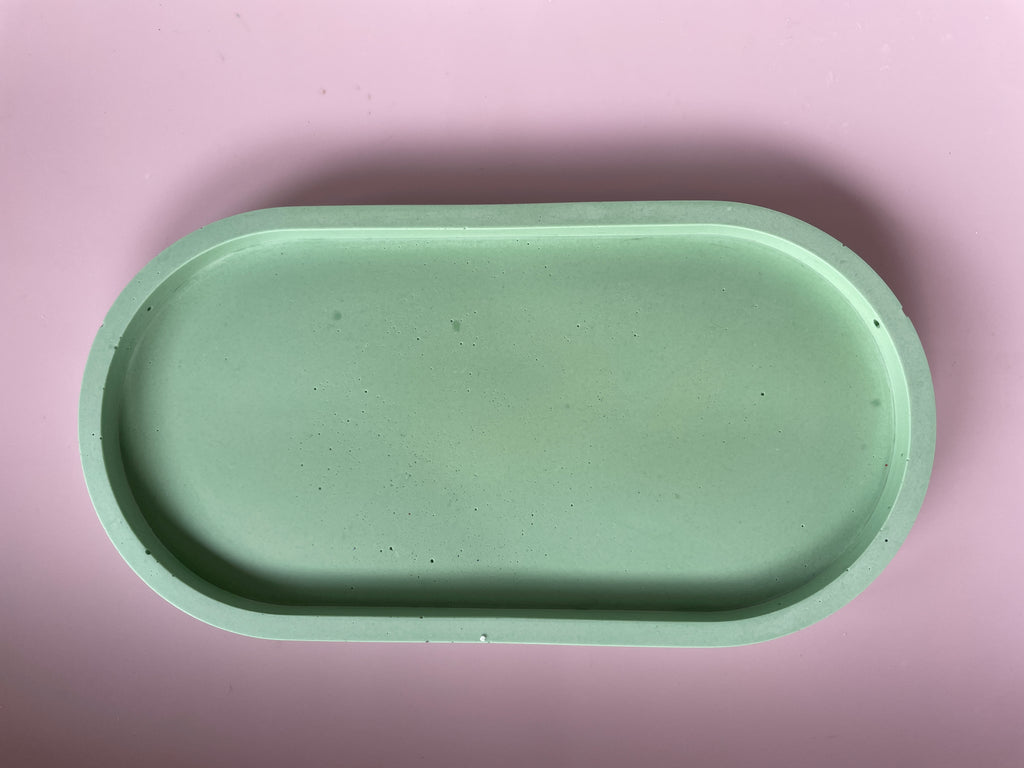 Green solid colour oval tray.