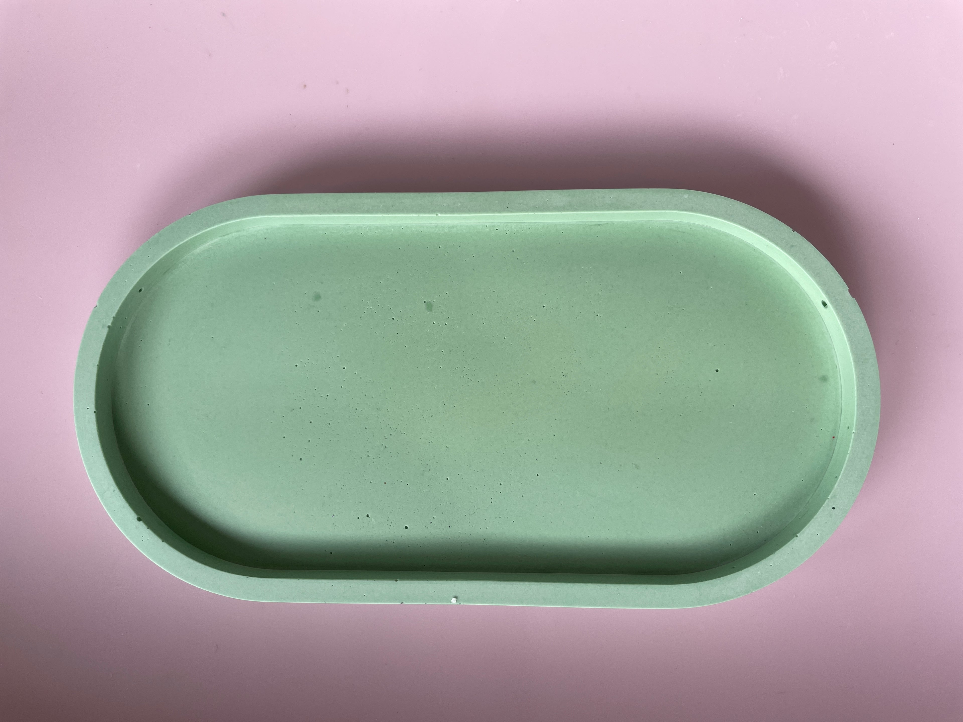 Green solid colour oval tray.