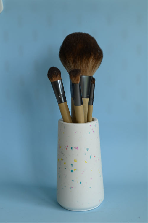 terrazzo pot with make-up brushes